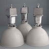 Three vintage industrial white pendant lights by Thorlux with a sturdy aluminium housing and white enamel dome shade at 460mm diameter. 