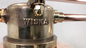 A bespoke copper and brass explosion proof 3 pendant ceiling lighting bar by Wiska. A perfect industrial style ceiling lamp for hanging over a snooker table, dining table or hang low over a kitchen island. 