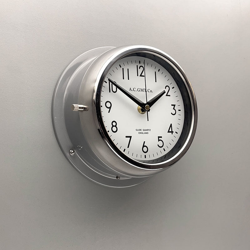 Grey nautical wall clock with quartz silent sweep seconds hand movement meaning no ticking. The silent wall clock has a white face with black digits and is 20cm diameter. Classic wall clock to suit any interior.