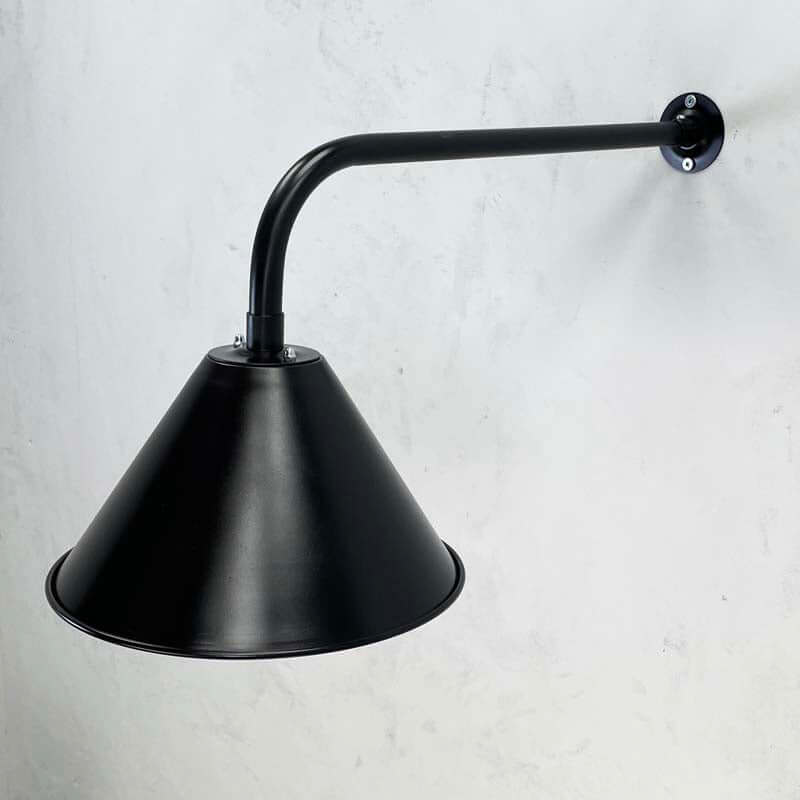 A satin black industrial style wall lamp made new in England by Loomlight. 