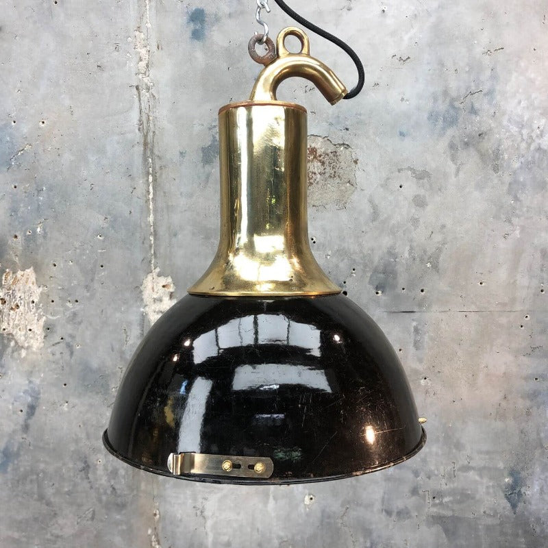 A brass and black enamel industrial ceiling pendant.