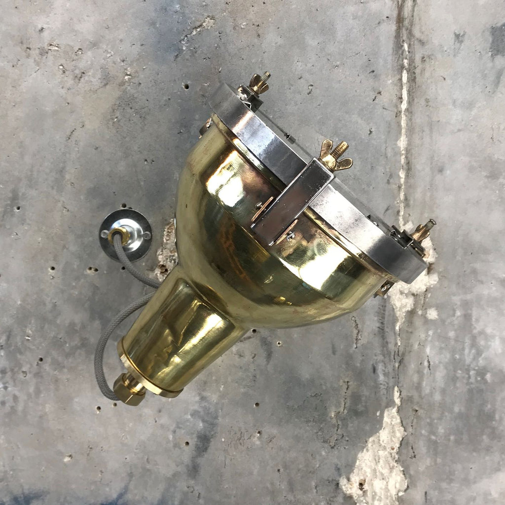 A reclaimed retro industrial cast brass directional outdoor wall washer light.