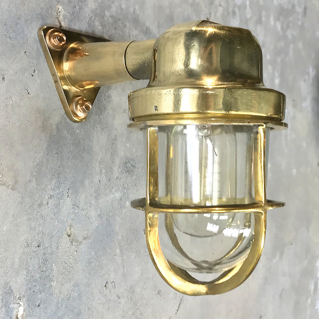 Shop our vintage outdoor light, professionally restored. An industrial style brass outdoor wall light compatible with LED light bulbs. With protective brass cage.