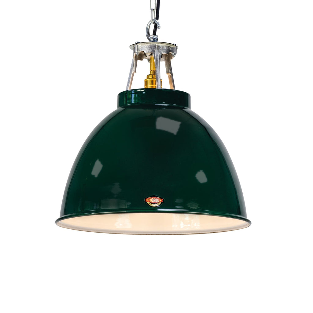 A green vitreous enamel pendant light called a Drum by Thorlux. These 1930's style green enamel shades are hand made ideal for rustic style interiors. 