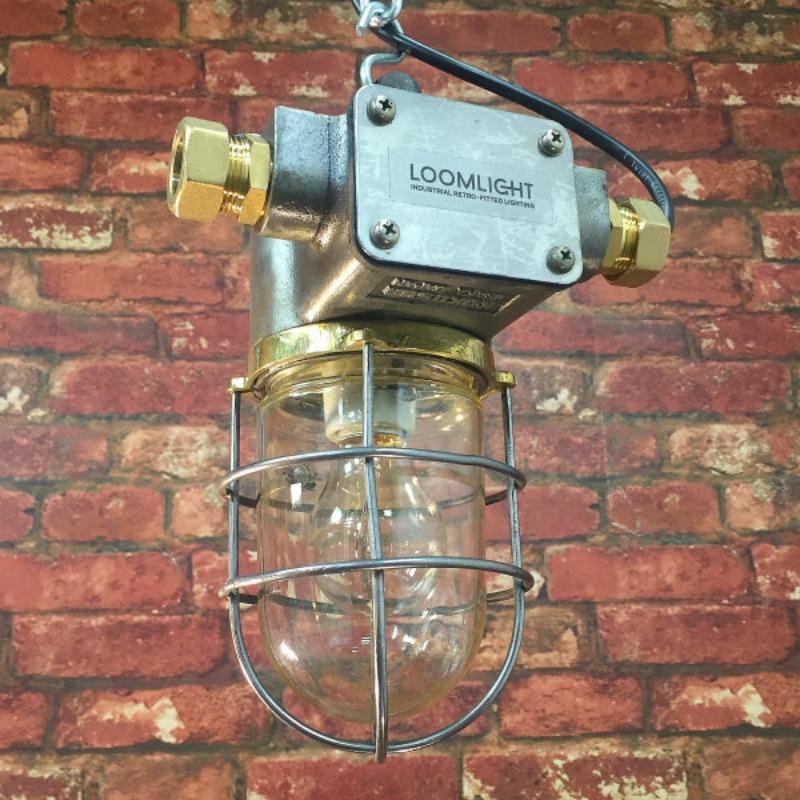 A vintage industrial explosion proof ceiling pendant 