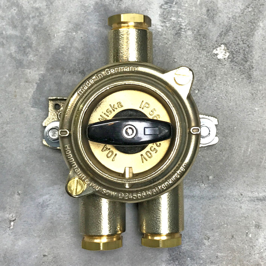 A vintage industrial surface mounted brass light switch by Wiska with 3 entry ports. Original & reclaimed HNA Rotary isolator switch