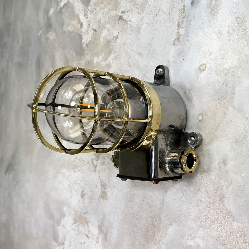 Vintage industrial cage wall light in brass & iron by Kokosha. Original restored lighting for modern interiors. Compatible with LED light bulbs.