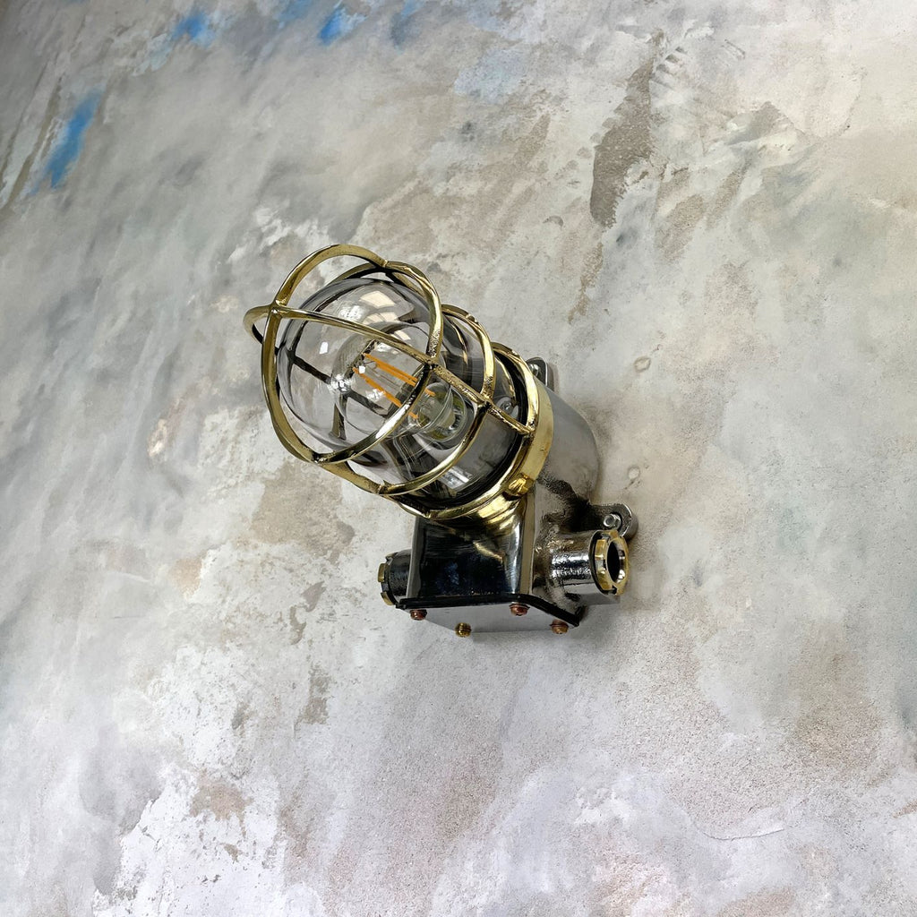 Vintage industrial cage wall light in brass & iron by Kokosha. Original restored lighting for modern interiors. Compatible with LED light bulbs.