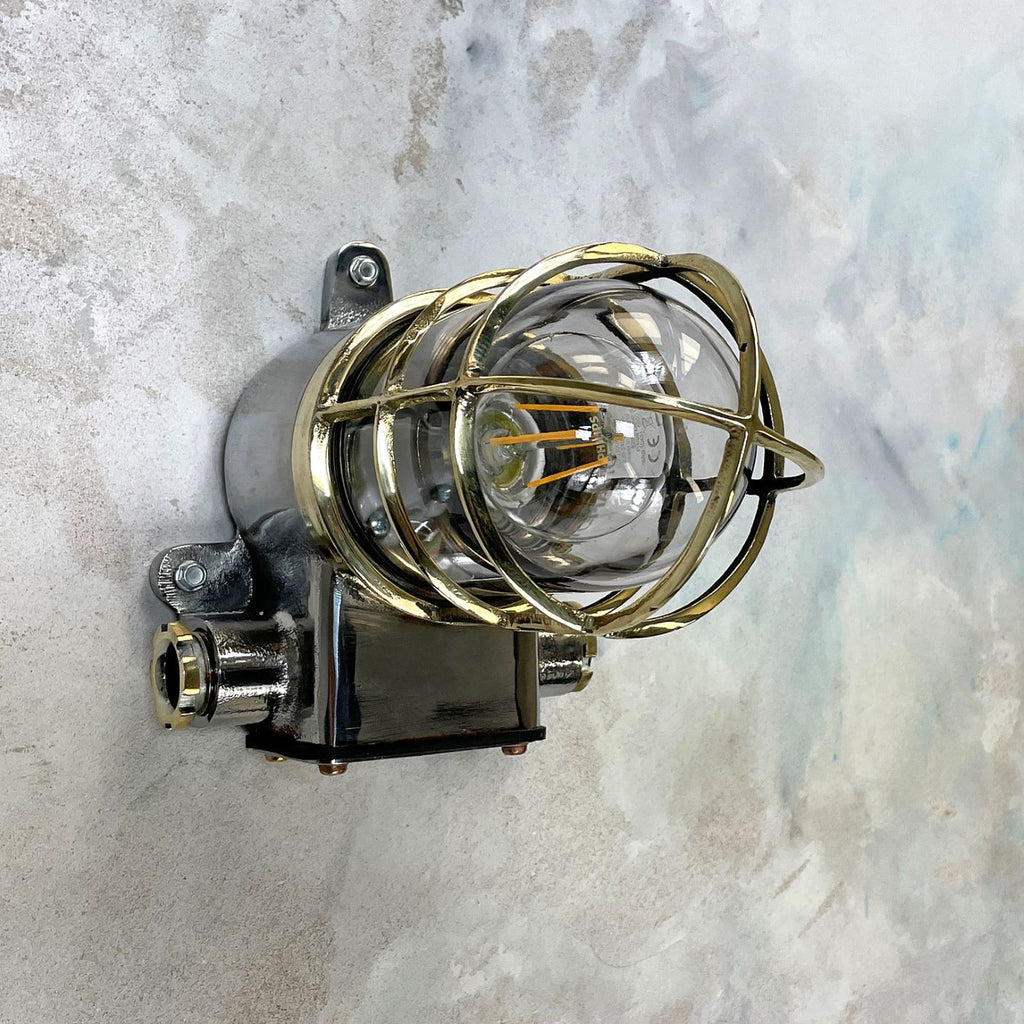 Vintage industrial cage wall light in brass & iron by Kokosha. Original restored lighting for modern interiors. Compatible with LED light bulbs. 