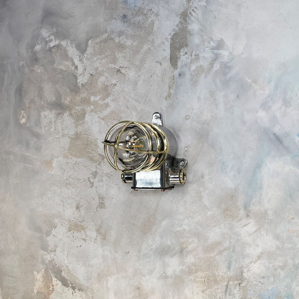 Vintage industrial cage wall light in brass & iron by Kokosha. Original restored lighting for modern interiors. Compatible with LED light bulbs.
