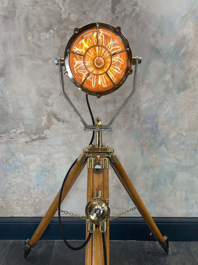 A stunning vintage brass Matteo Miletech lamp paired with a wooden British antique surveyors tripod, to create a completely unique floor lamp. There is limited availability of this item.  