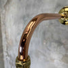 Bespoke wall light with copper & brass cantilever arm with a cream British army festoon lamp shade.