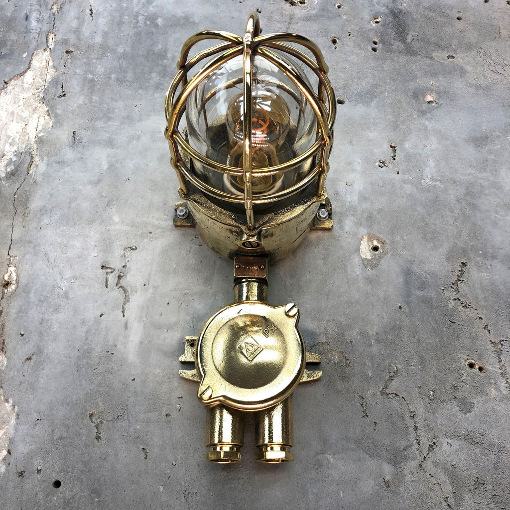 A vintage industrial Wiska industrial brass wall light with a protective brass wire cage & junction box.  