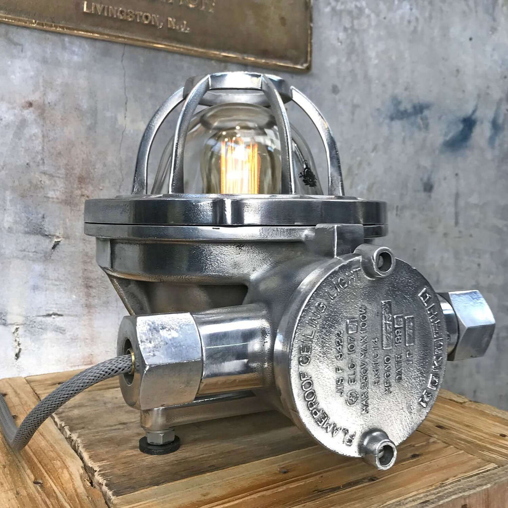 Shop our aluminium industrial table lamp by Kokosha. An industrial cage lamp, reclaimed & restored for modern interiors