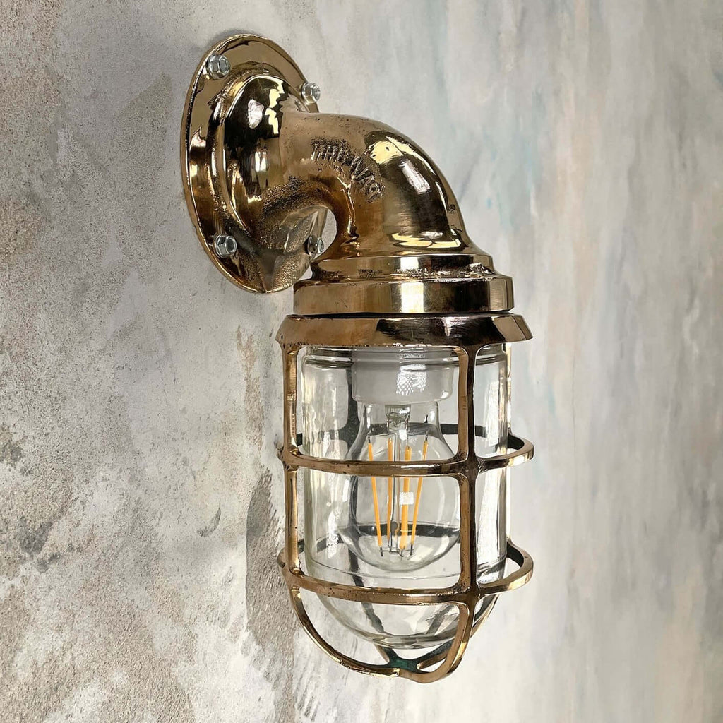 Outdoor vintage wall light made by Crouse Hinds using Bronze and glass. A highly robust vintage industrial outdoor wall sconce for all weathers