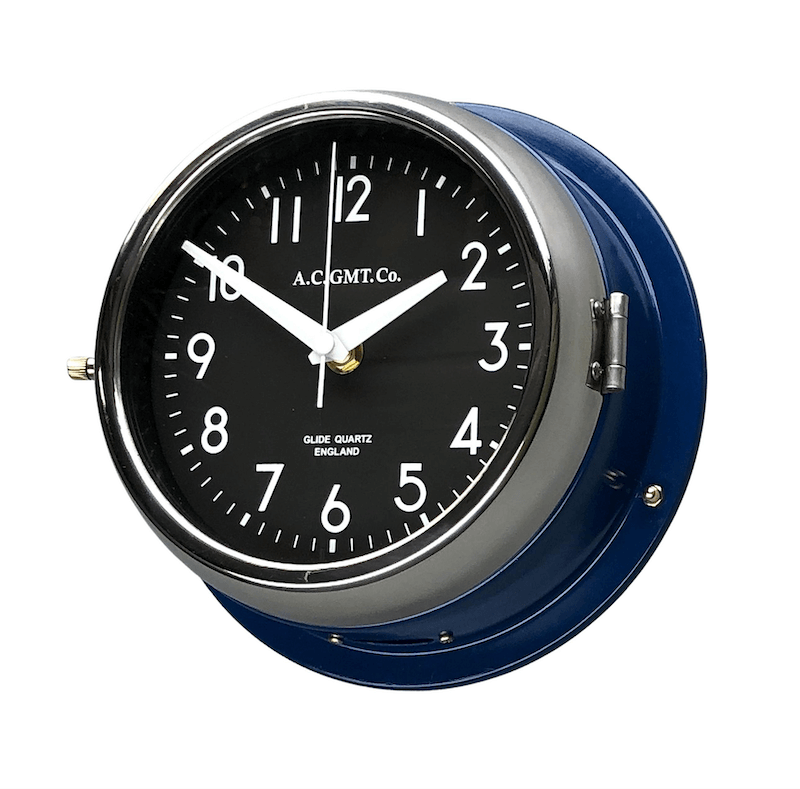 Navy blue nautical wall clock with black face and quartz silent sweep seconds hand movement making this a non ticking clock