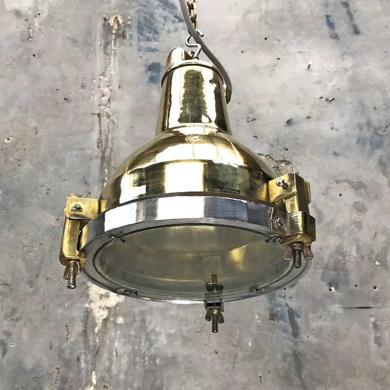 A reclaimed vintage industrial brass spot light ceiling pendant
