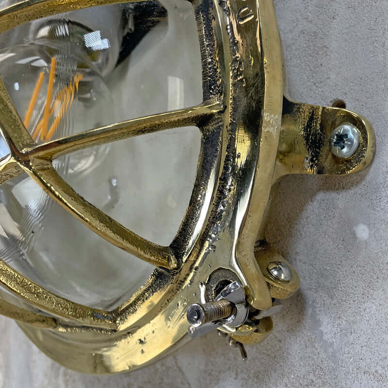 Shop our vintage brass wall sconce reclaimed from the marine industry. The circular bulkhead is professionally restored and compatible with LED light bulbs. We ship worldwide. 