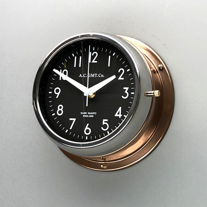 A non-ticking copper circular wall clock with black face, reclaimed and restored by AC.GMT.Co.