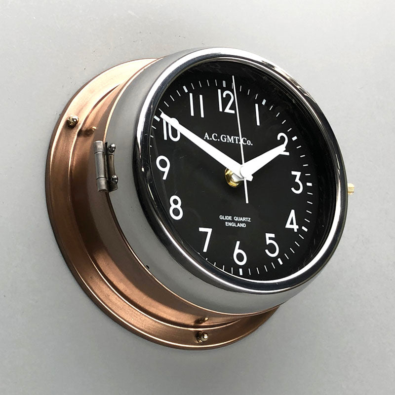 A non-ticking copper circular wall clock with black face, reclaimed and restored by AC.GMT.Co.