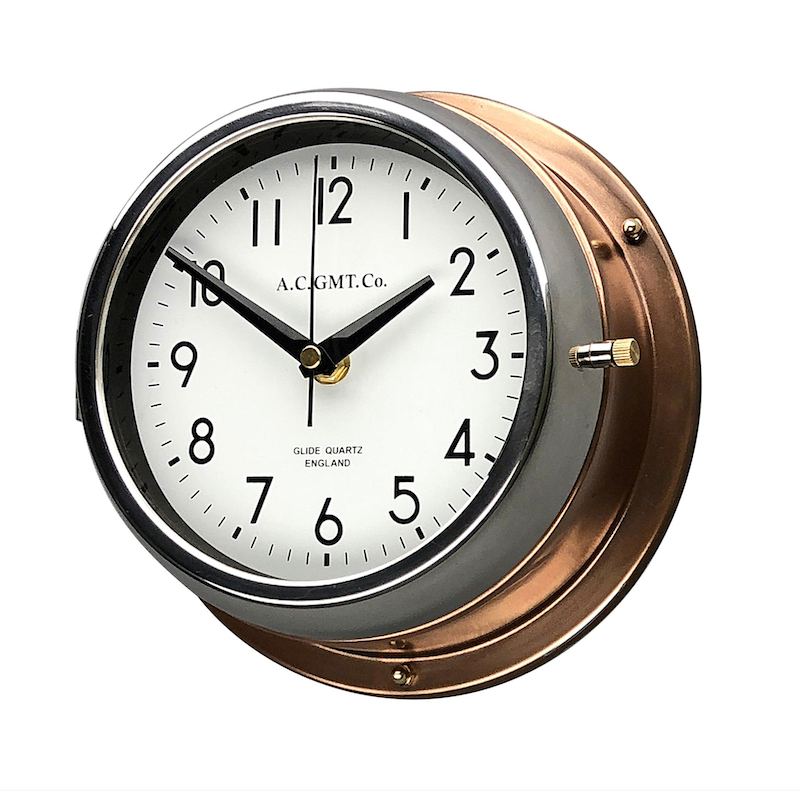 nautical style copper wall clock with silent sweep seconds hand movement meaning no ticking, has a white face with black digits. It is 20cm diameter. A timeless design perfect for contemporary interiors. 