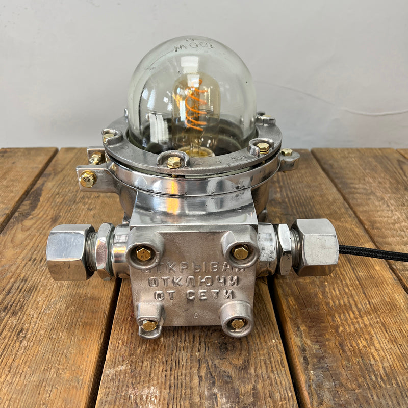 Eastern Bloc nautical aluminium table lamp reclaimed from decommissioned 1980's cargo ships. Professionally restored and rewired by hand in our workshop, ready to be reused in modern interiors or outdoor living spaces. 