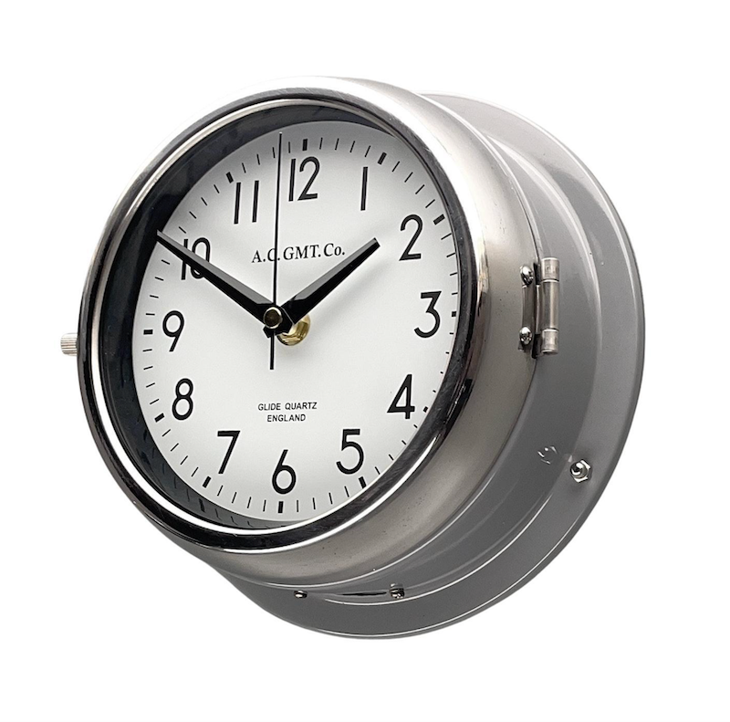 Grey nautical style wall clock with quartz silent sweep seconds hand movement meaning no ticking. It has a white face with black digits and is 20cm diameter. Timeless wall clock to suit any contemporary interior. 