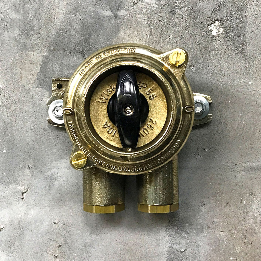 A vintage industrial surface mounted brass light switch by Wiska with 2 entry ports. This is a water tight light switch for indoor or outdoor use.