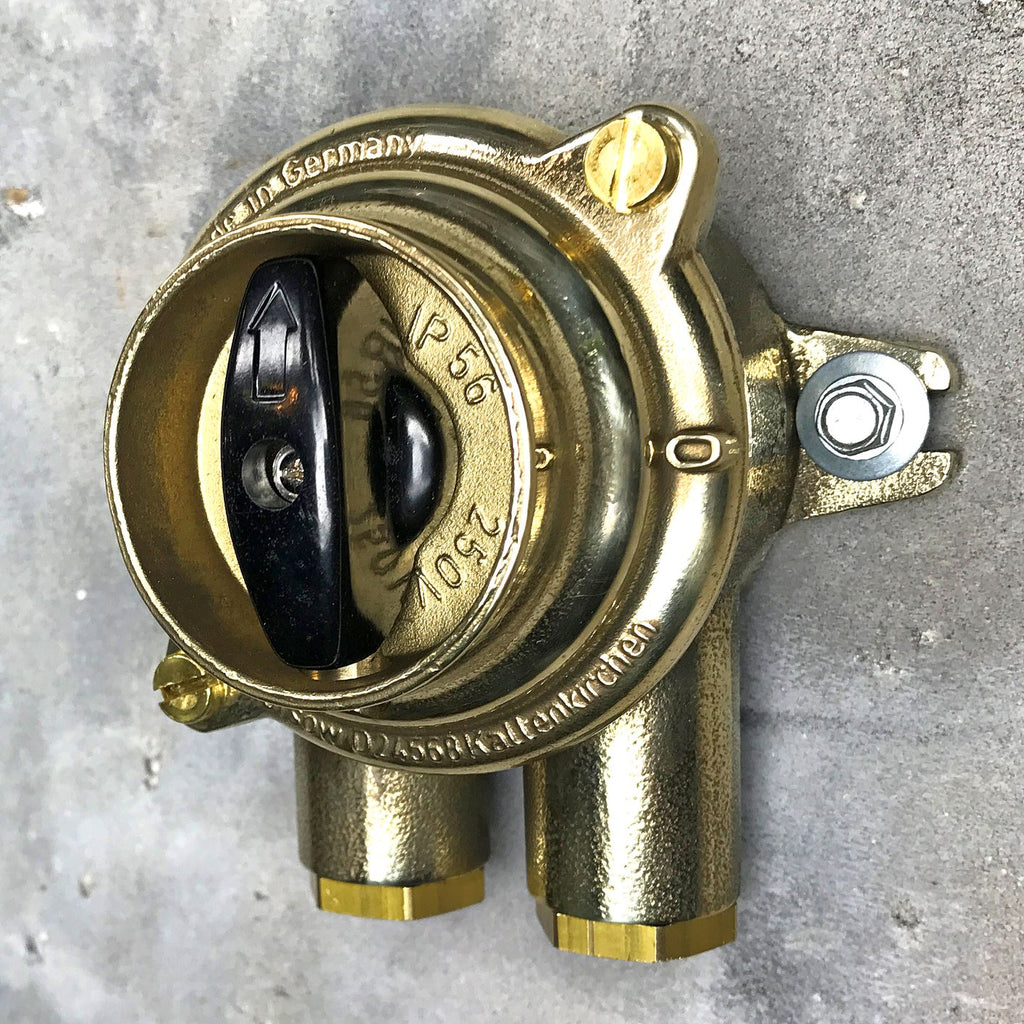 A vintage industrial surface mounted brass light switch by Wiska with 2 entry ports. This is a water tight light switch for indoor or outdoor use.