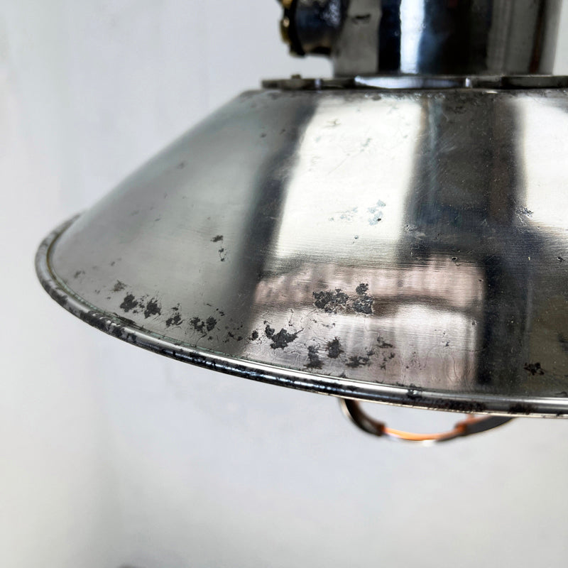 Vintage industrial cage ceiling light made from cast steel with LED filament light bulb. professionally refurbished by British lighting restoration specialists Loomlight. 