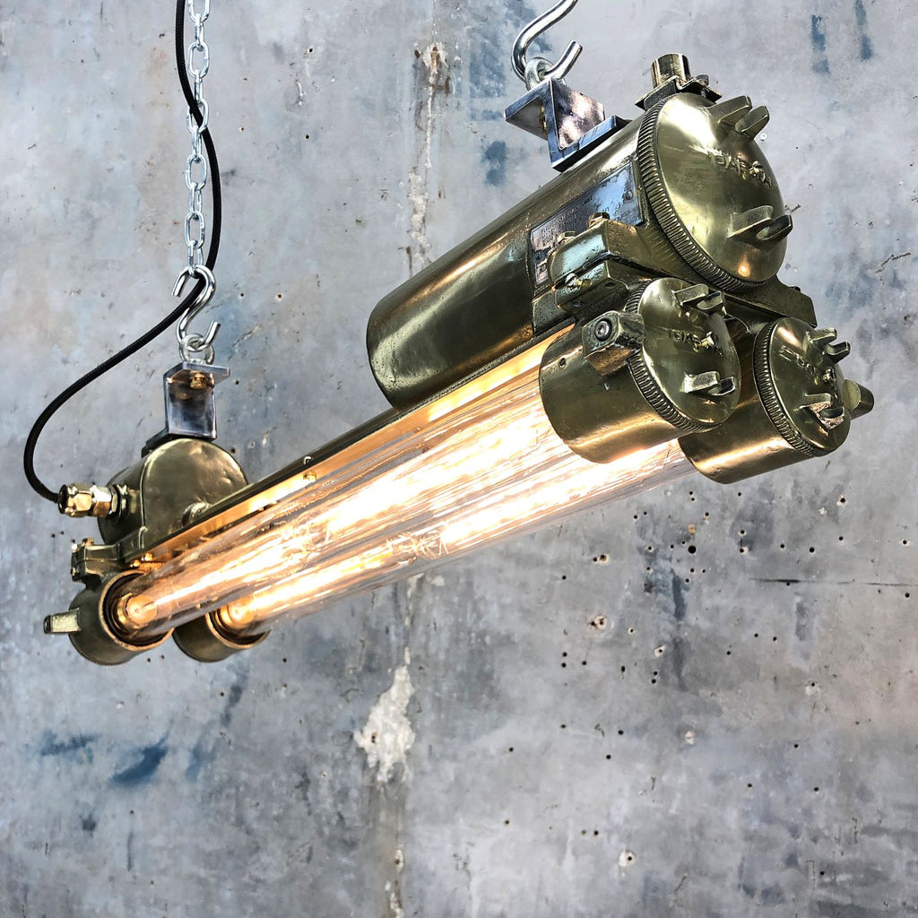 A vintage industrial brass ceiling flameproof tube light fitted with Edison LED tubes. 