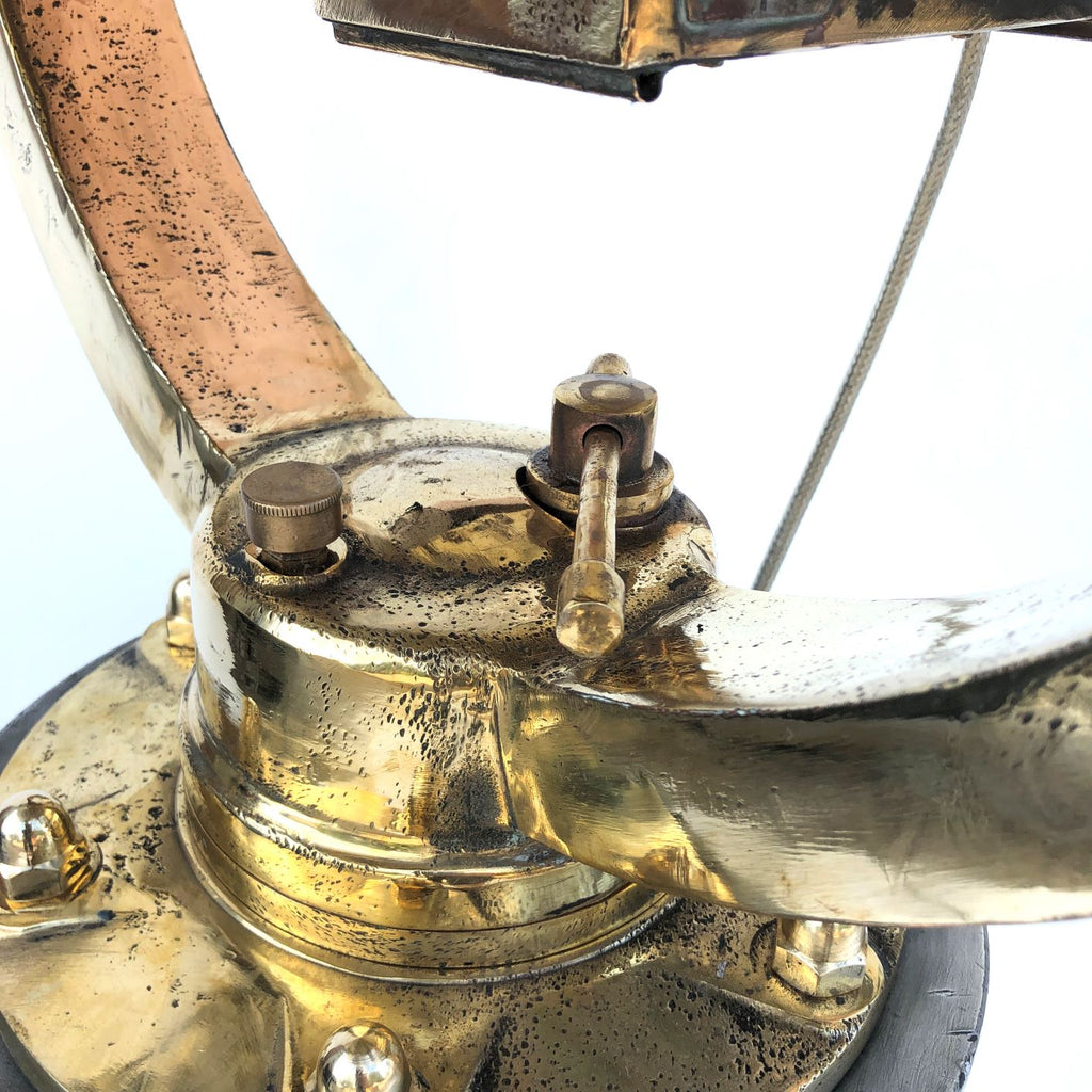Large vintage copper & brass signaling lamp and military tripod floor lamp.