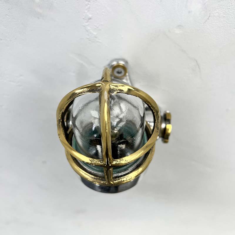 A small industrial aluminium and brass cage wall light originating from Japan. Reclaimed and restored