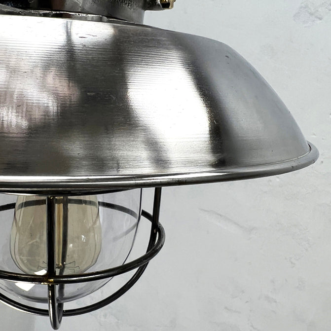 A vintage industrial cast steel explosion proof ceiling cage pendant light. Originating from Osaka Japan manufactured by Kokosha c1980.