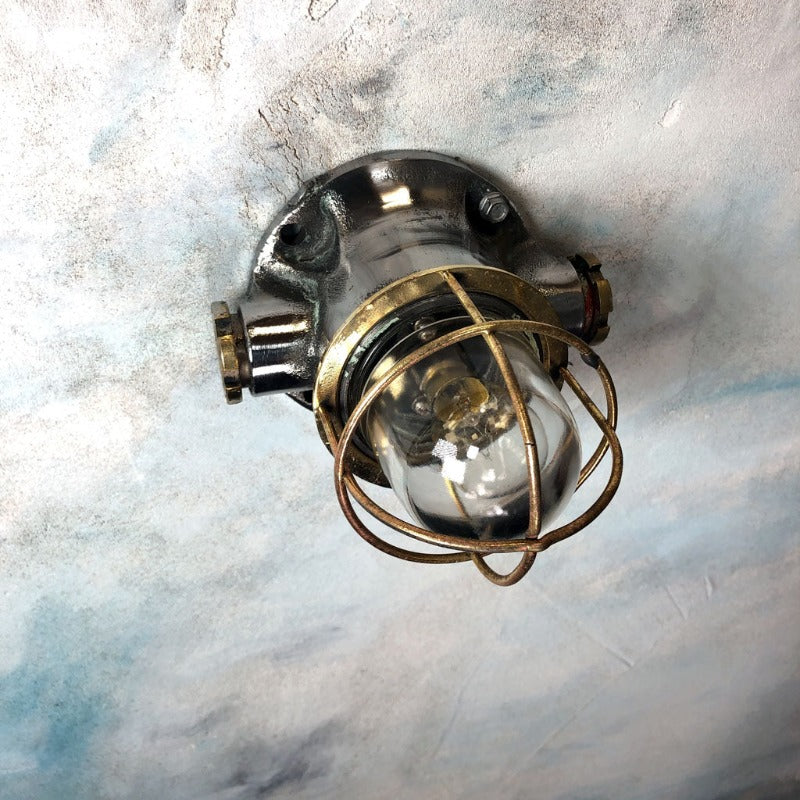 A small vintage industrial mild steel bulkhead wall light. 