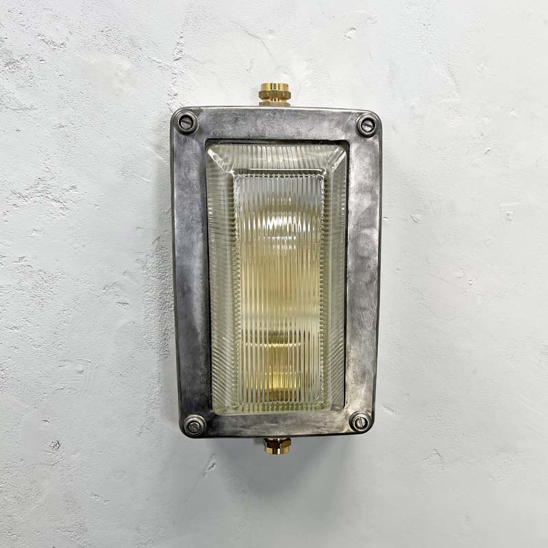 An industrial aluminium bulkhead wall light by General Electric Company made c1995. Reclaimed and restored by hand in UK by Loomlight, ready to be installed either vertically or horizontally.