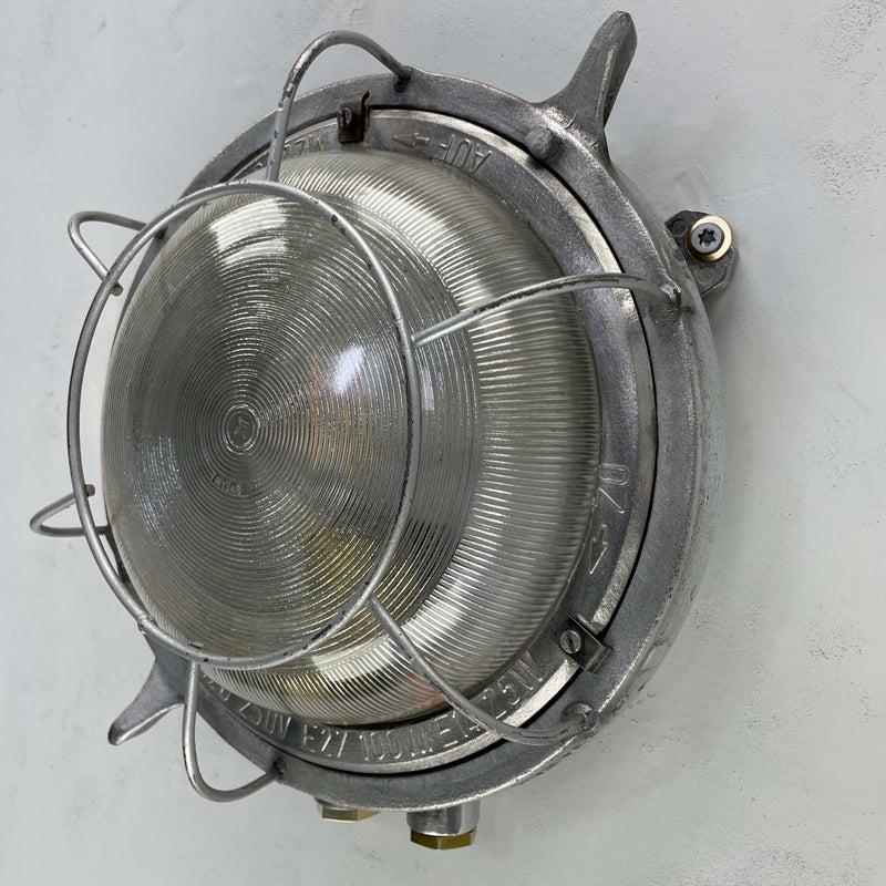 Vintage cast aluminium round bulkhead light with diffusion glass, made in GDR by EOW in the 1970's. Vintage industrial lighting which has been carefully restored