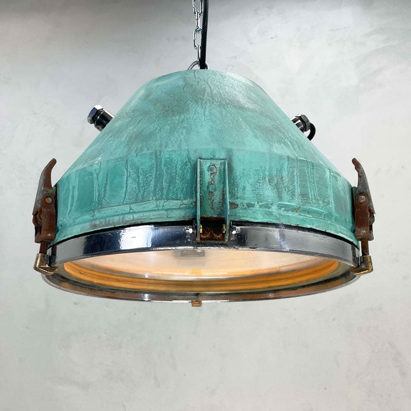 a vintage industrial bespoke verdigris pendant light by Loomlight. reclaimed and professionally refurbished. Unique vintage industrial lighting.