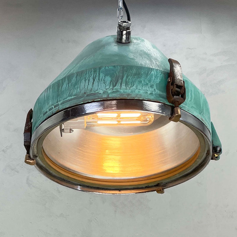a vintage industrial bespoke verdigris pendant light by Loomlight. reclaimed and professionally refurbished. Unique vintage industrial lighting.