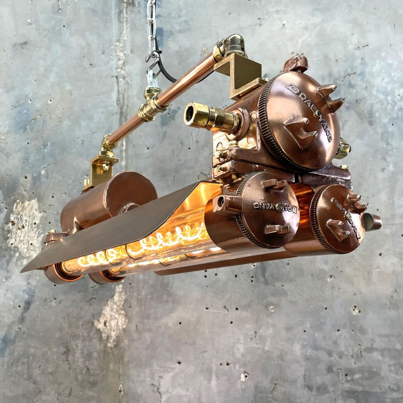 Vintage industrial copper flameproof Edison tube ceiling strip light with shades made by Daeyang in the 1970's 