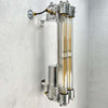 The Edison long wall light features 4 LED filament tubes. It is a reclaimed industrial fixture from 1976 which we have extensively restored and made ready for modern interiors. Made from Aluminium and glass