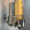 The Edison long wall light features 4 LED filament tubes. It is a reclaimed industrial fixture from 1976 which we have extensively restored and made ready for modern interiors. Made from Aluminium and glass